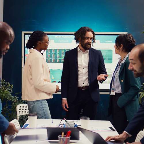 Employees addressing their team leader about practices and lessons learned, sharing issues in order to improve corporate culture within the enterprise. Discussing agenda for upcoming events. Camera B.