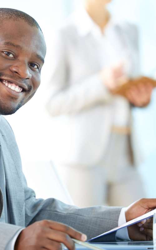 Portrait of a cheerful business worker smiling at the camera