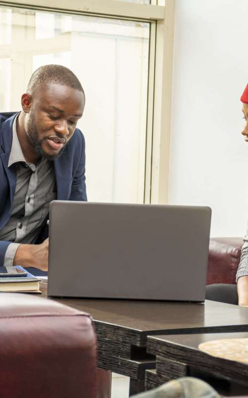 A closeup shot of two business colleagues in a small business meeting